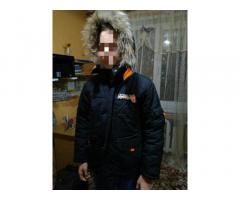 продам б\у практичную , удобную зимнюю куртку DONILO с капюшоном